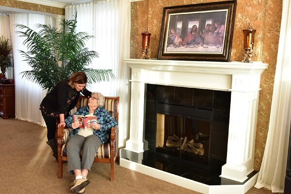 Women sitting near fireplace